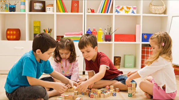 Children learning and playing together during a group session
